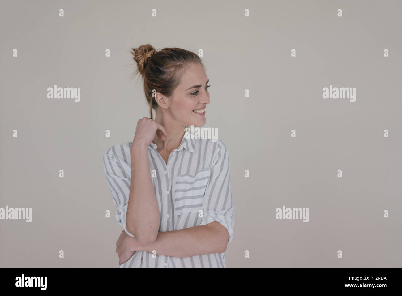 Portrait of a pretty woman, smiling, looking away Stock Photo