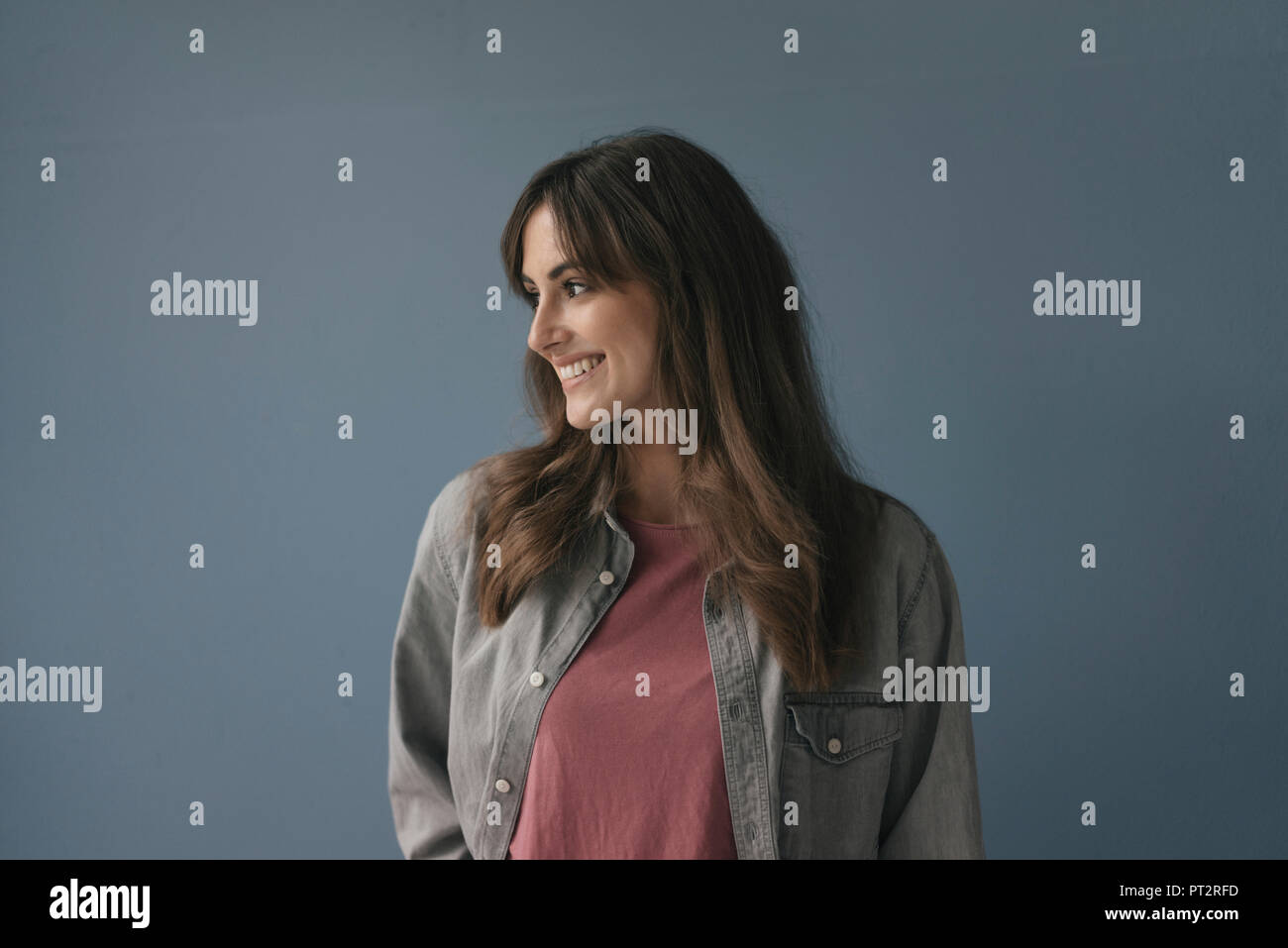 Smiling woman looking away Stock Photo