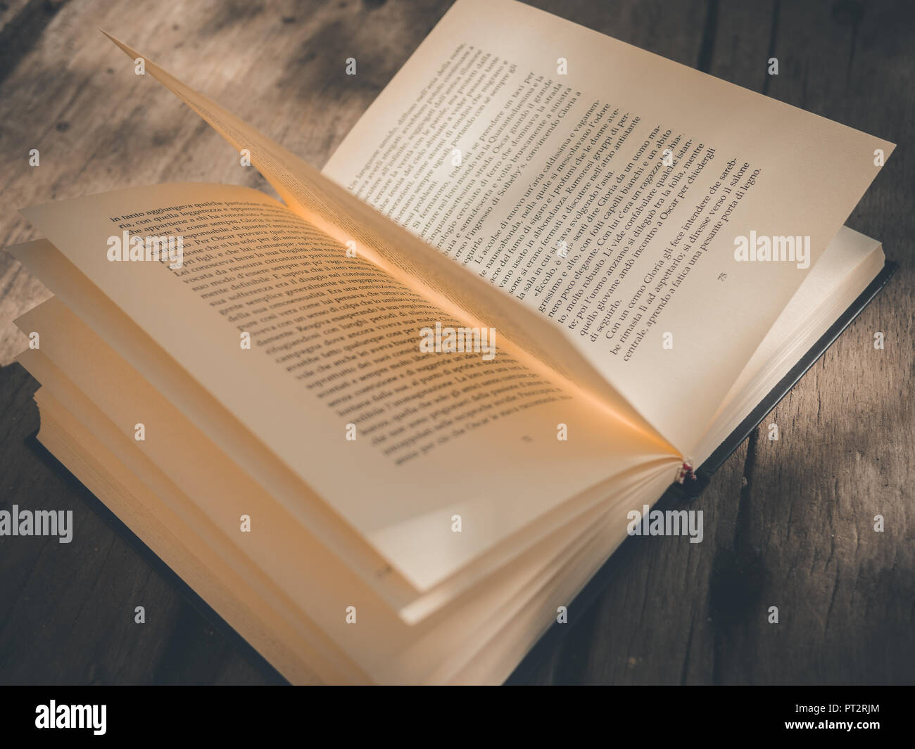 book opened on wood table Stock Photo