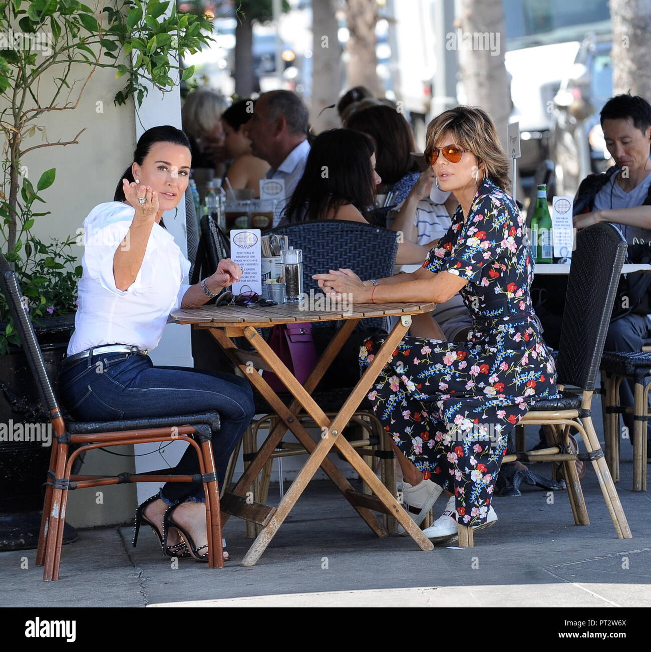 Kyle Richards arrives to meet Lisa Rinna in a three wheel Vanderhall ...