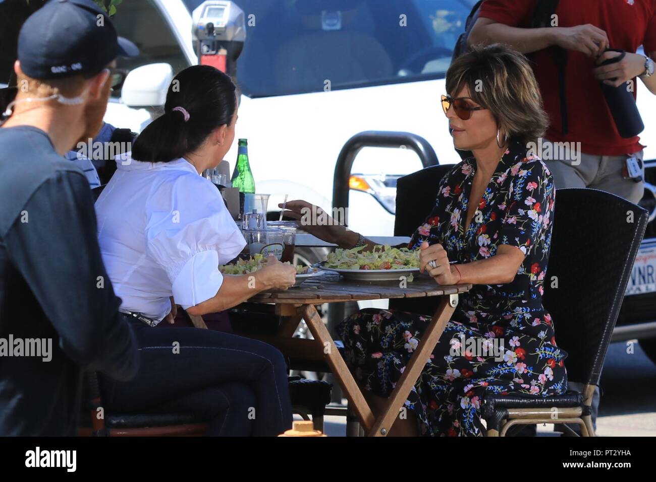 Kyle Richards arrives to meet Lisa Rinna in a three wheel Vanderhall ...