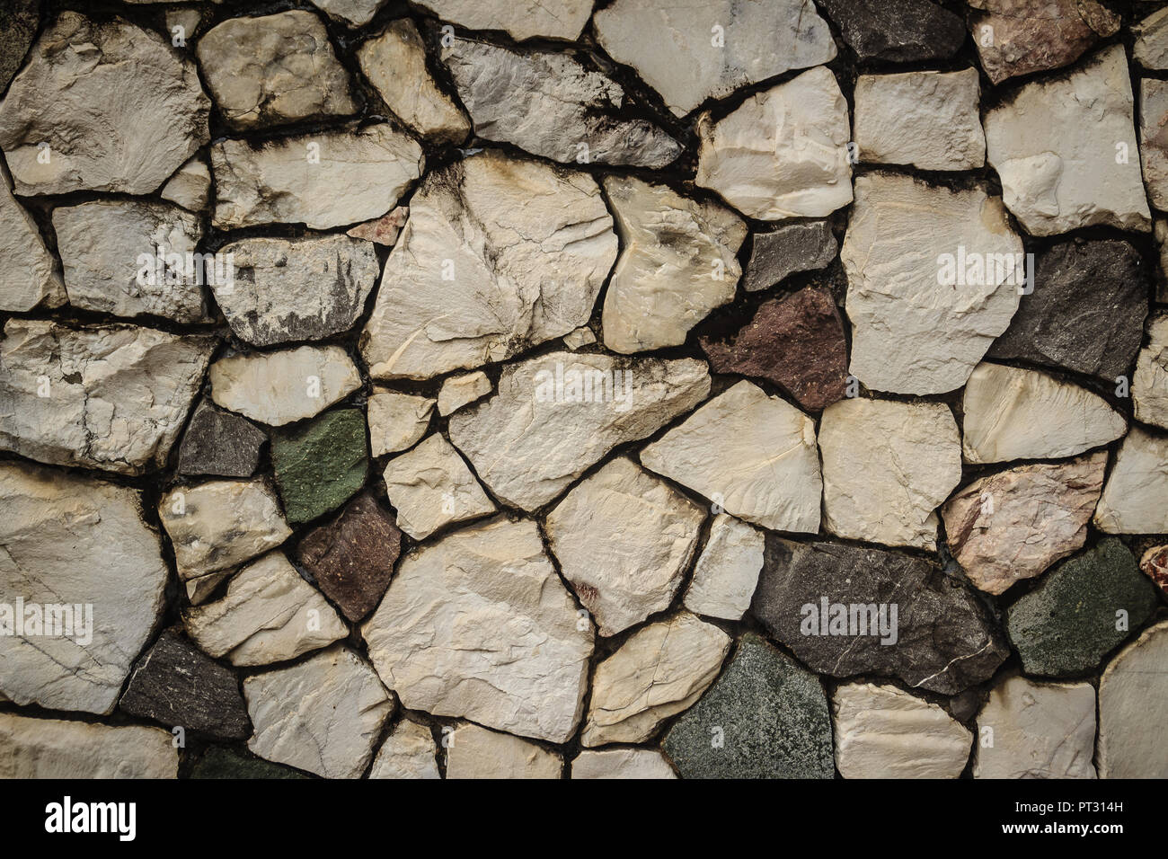 Vintage nature cobblestone wall in disorganized arrangement pattern ...