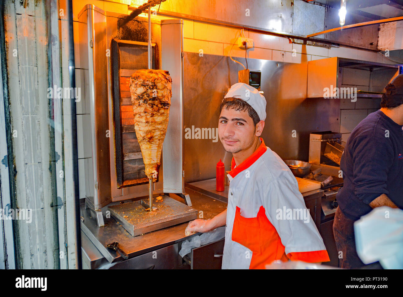 Shawarma shop employee in Amman, Jordan who made my chicken shawarma sandwich. Stock Photo