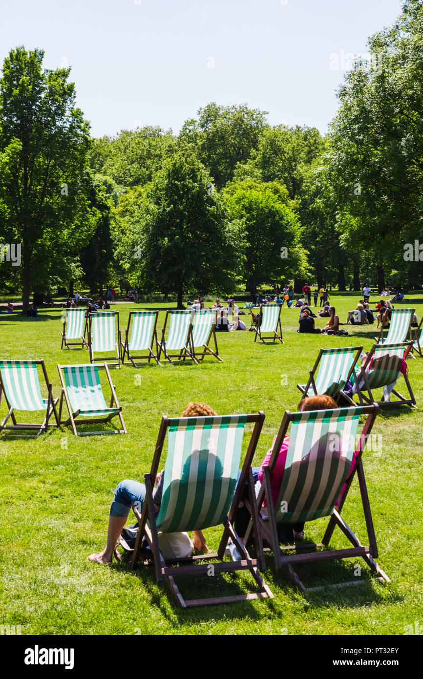 England, London, Green Park, People Relaxing in Deck Chairs Stock Photo