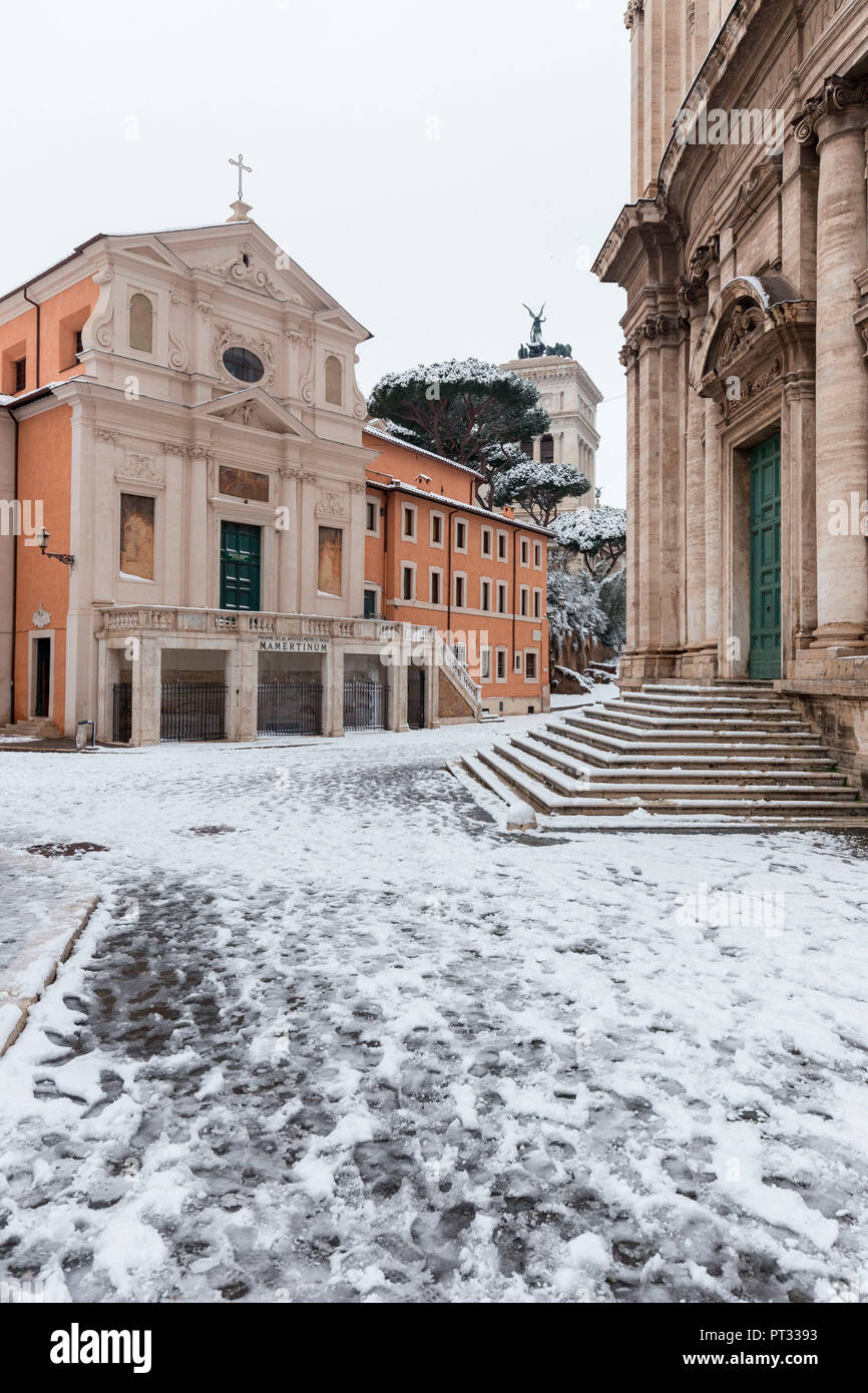 The Church of San Giuseppe dei Falegnami and Church of Santi Luca e Martina after the great snowfall of Rome in 2018 Europe, Italy, Lazio, Province of Rome, Rome Stock Photo