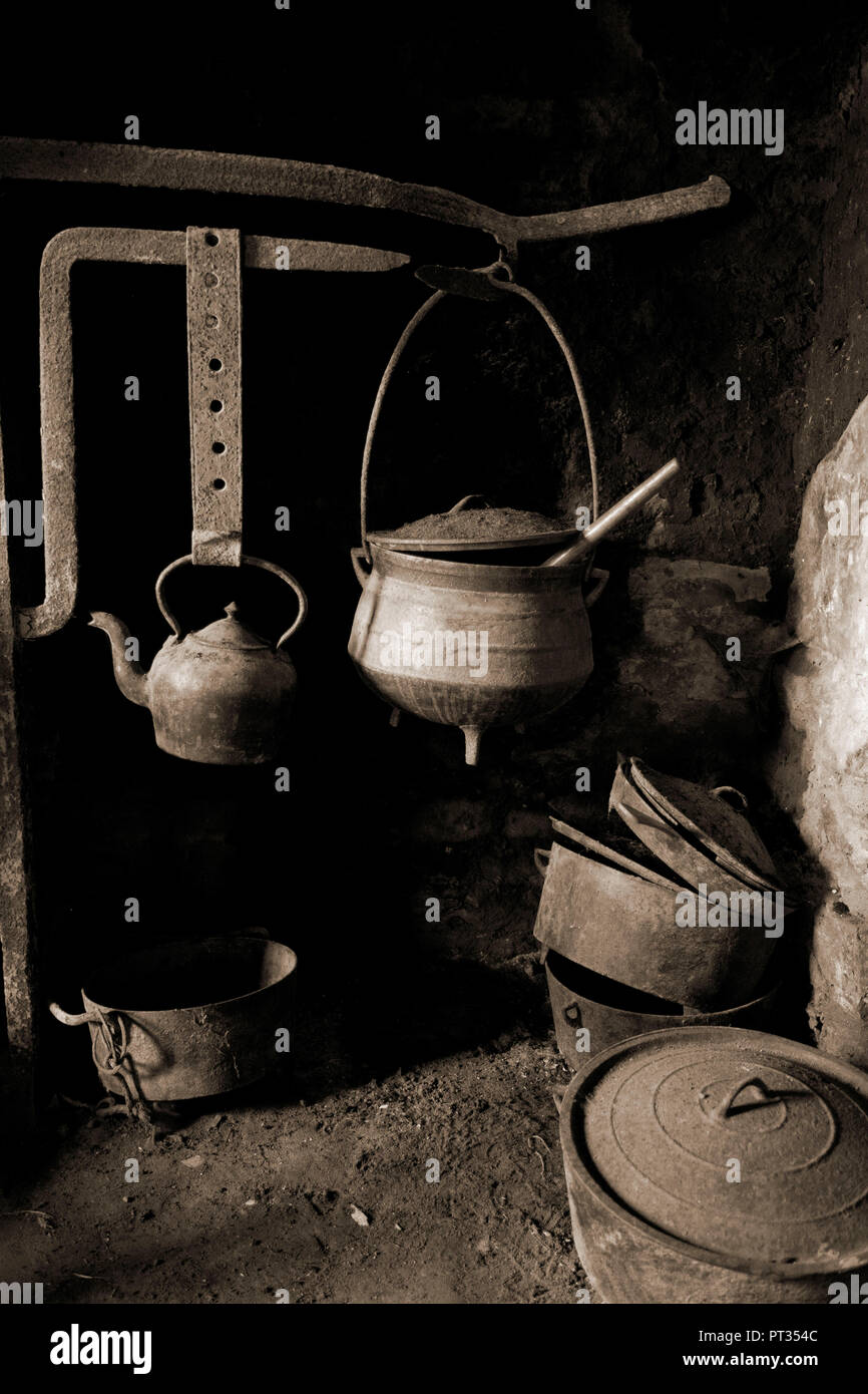 antique old pots on a fireplace, Old cabin on Dingle Peninsula, Ireland, Stock Photo