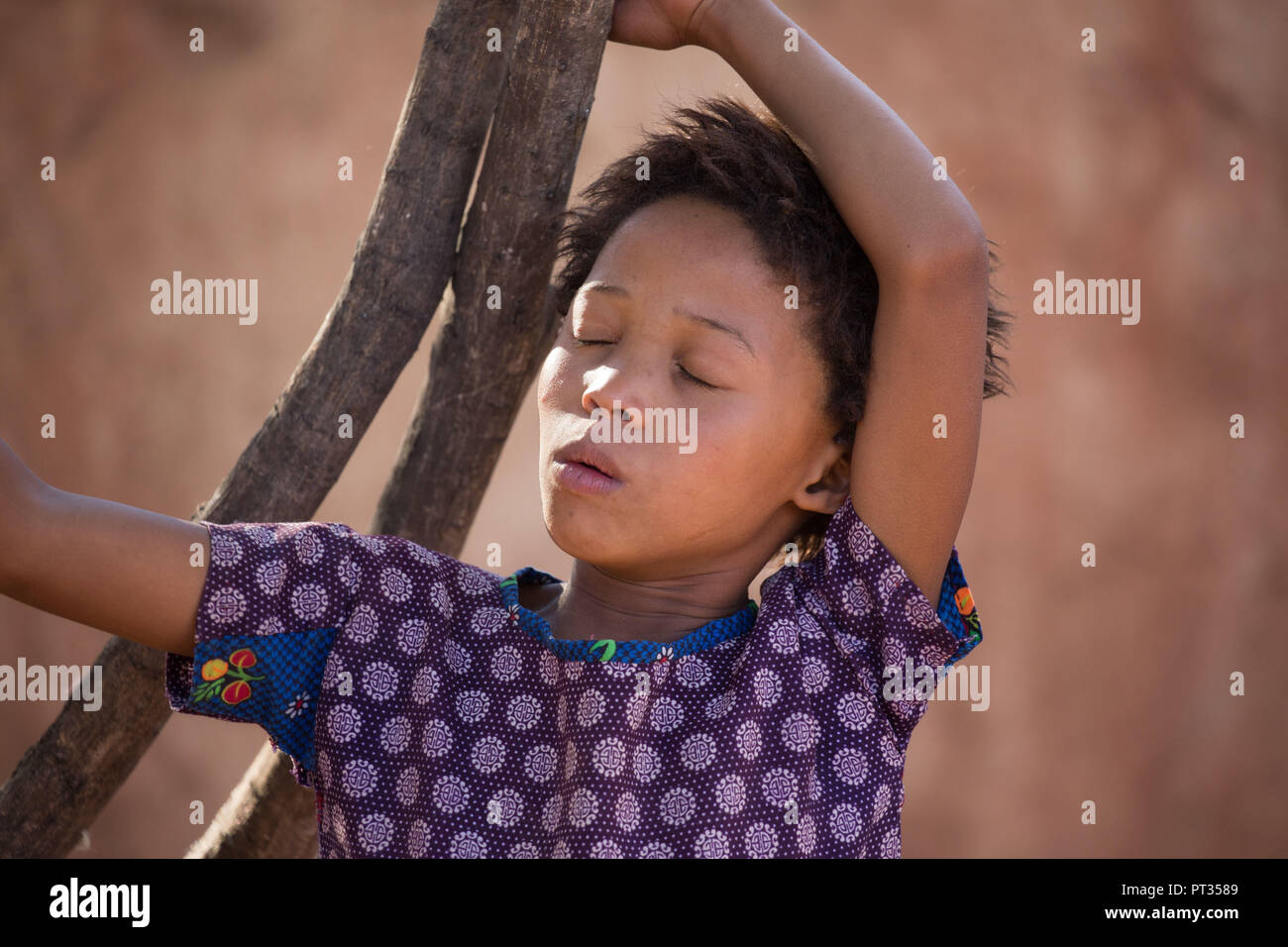Dreaming San girl, bushmen Stock Photo