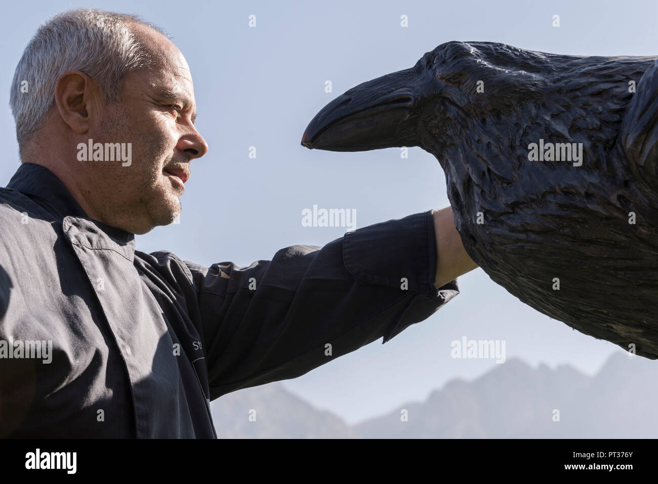 Stefan Pramstaller with raven figure, Romantik Hotel Turm, Fiè allo Sciliar, Alpe di Siusi, Eisacktal, South Tyrol, Italy Stock Photo