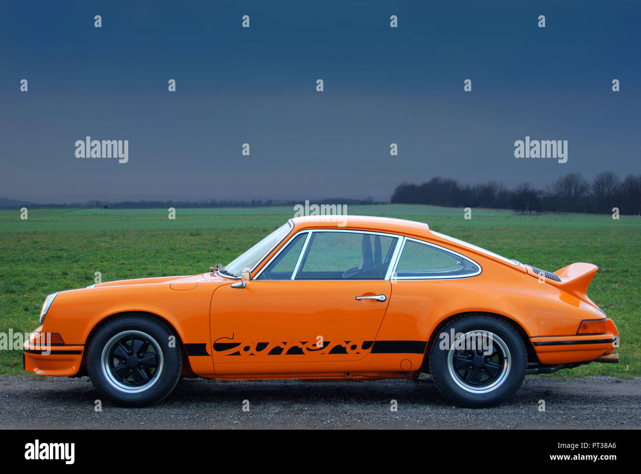 An orange Porsche 911 Carrera RS in profile Stock Photo - Alamy