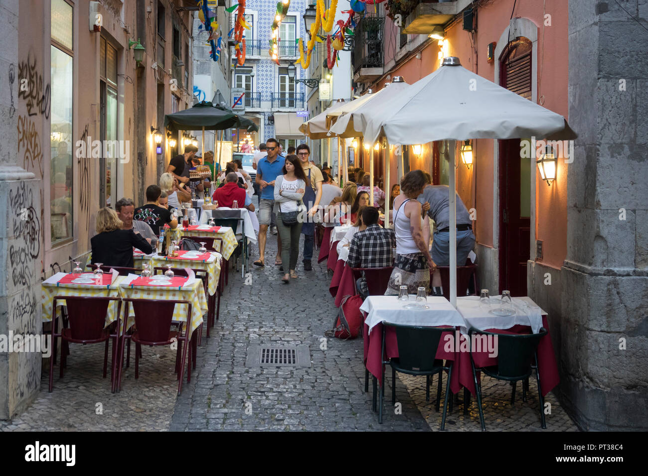 Portugal, Lisbon, side street with restaurant catering in the old town