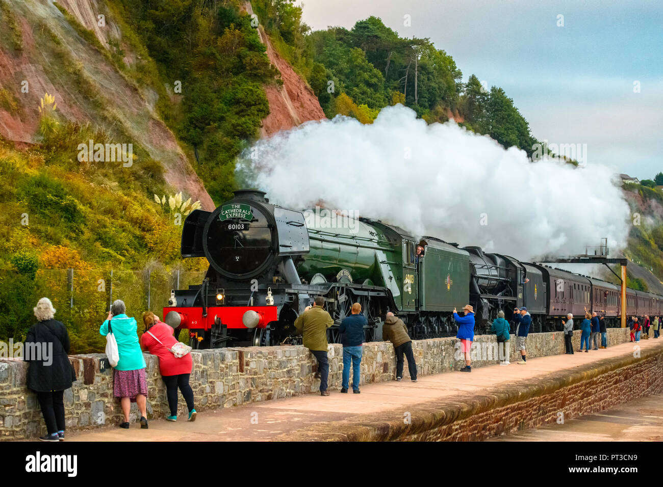 Steam locomotives 60103 Flying Scotsman double headed with 44871 'Black Five' hauling The Cathedrals Express past  the sea wall Teignmouth Devon UK Stock Photo