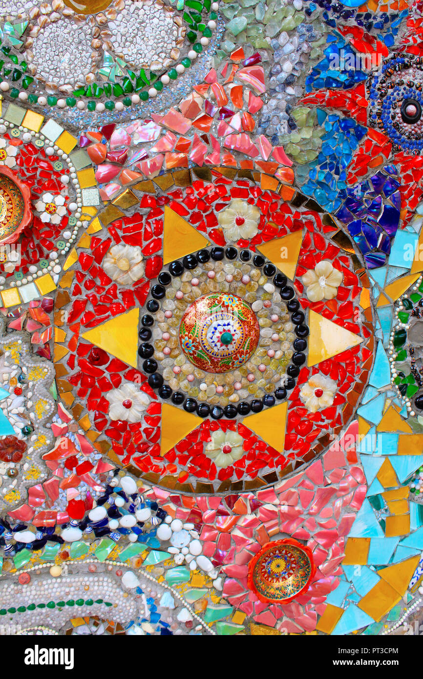 Lovely colorful mosaic designs with pottery shards, at Pha Sorn Kaew