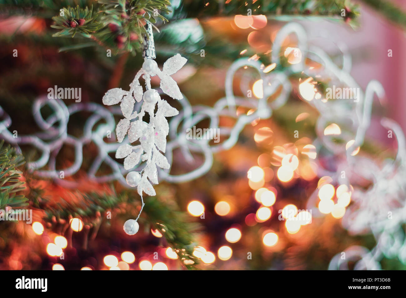 Christmas greeting in  a Christmas branch decorated with a Christmas decoration. Stock Photo