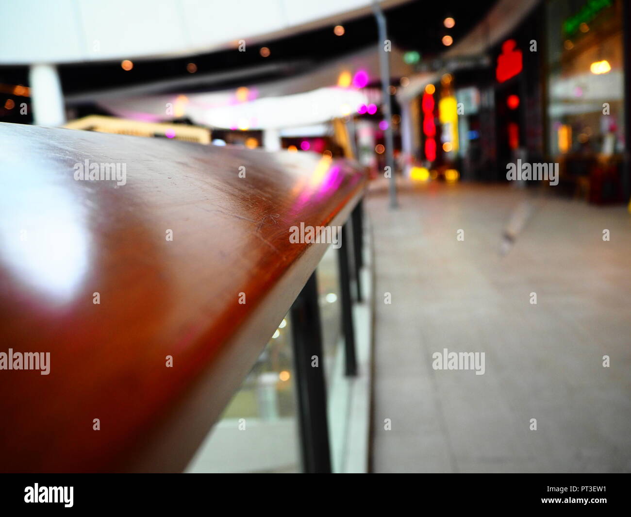Wooden railing in the shopping mall on blur background with copy space ...