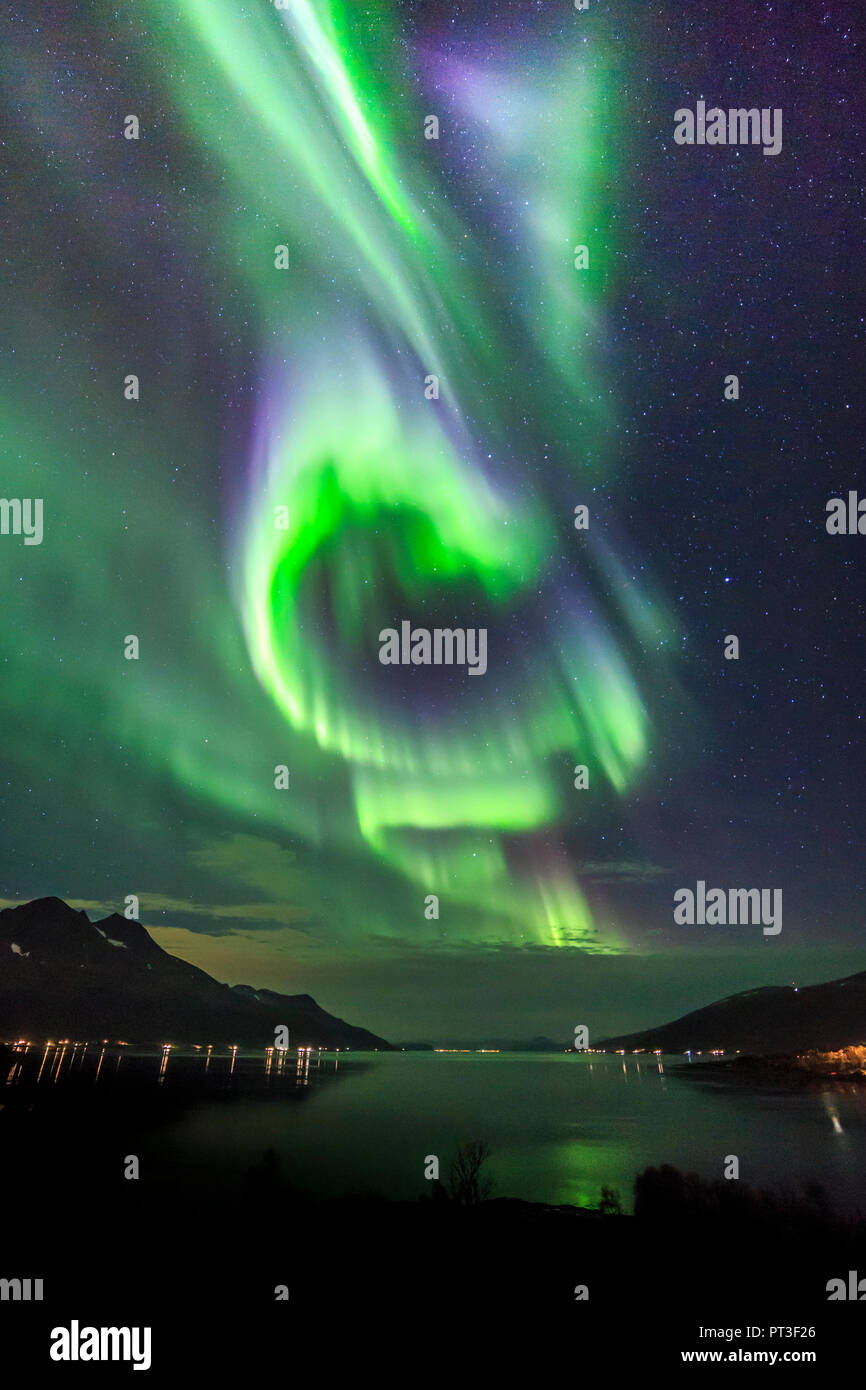 Aurora borealis or northern lights, active coloured curtains moving across night  sky, Arctic Circle Kvaloya island Troms Tromso norway Stock Photo - Alamy