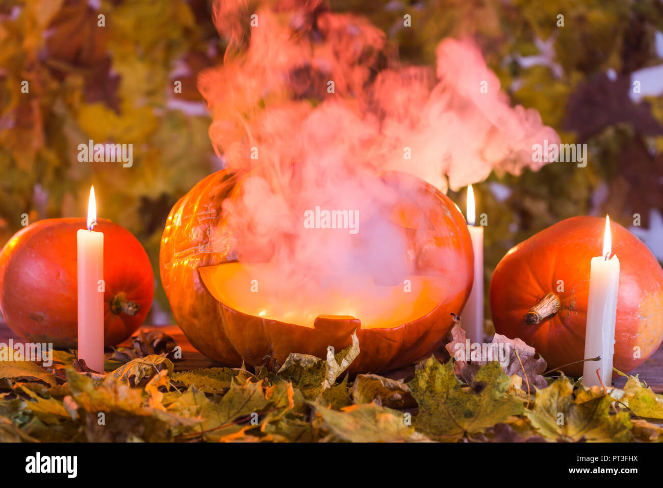 Jack-o-Lantern halloween pumpkin with mist pouring from its mouth Stock Photo