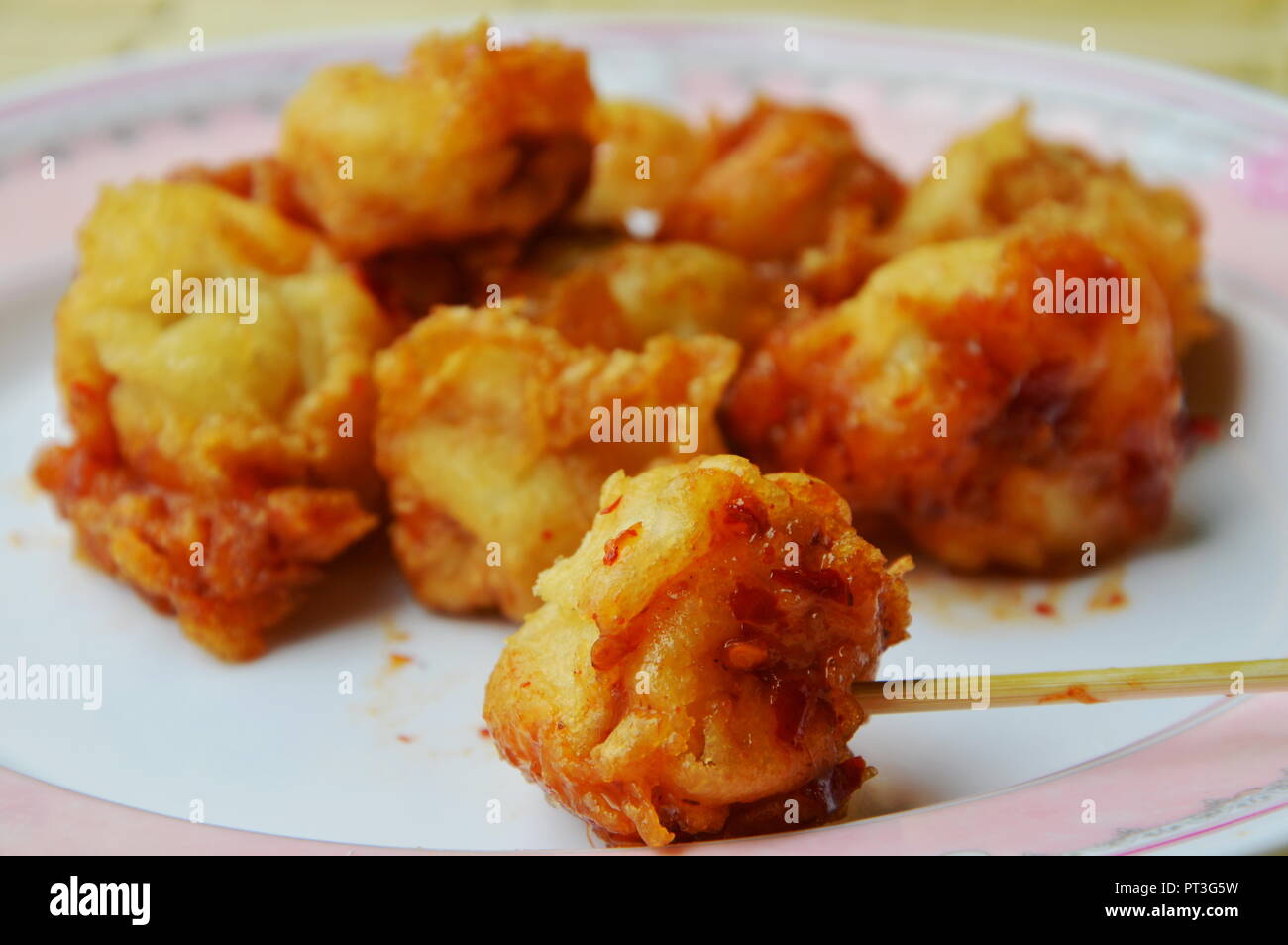 deep fried fish ball dressing chili sauce and wooden stick Stock Photo Alamy