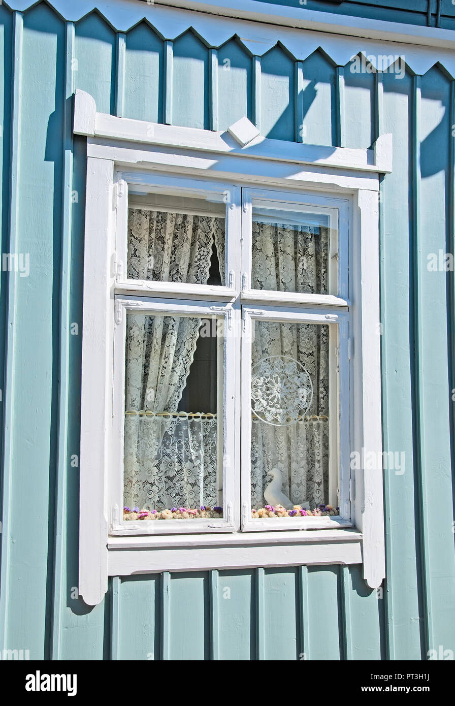 RAUMA, FINLAND - JULY 6, 2013: White lace in the window. Rauma is famous for high quality lace (known from the XVII century). Stock Photo