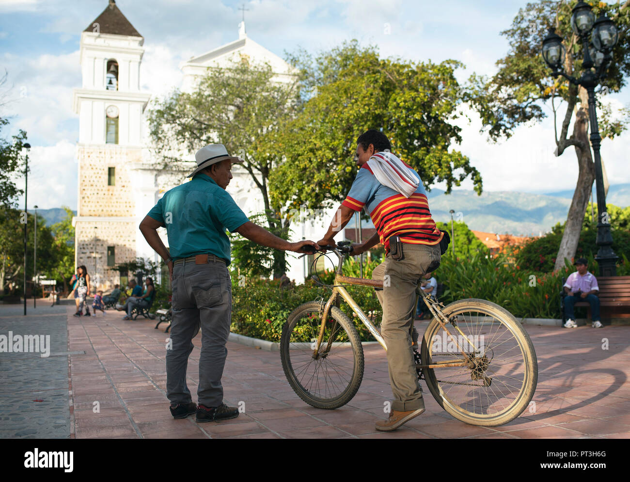 Unknown men talking on Plaza de Bolivar. Social life in Santa Fe de Antioquia, Colombia. Sep 2018 Stock Photo