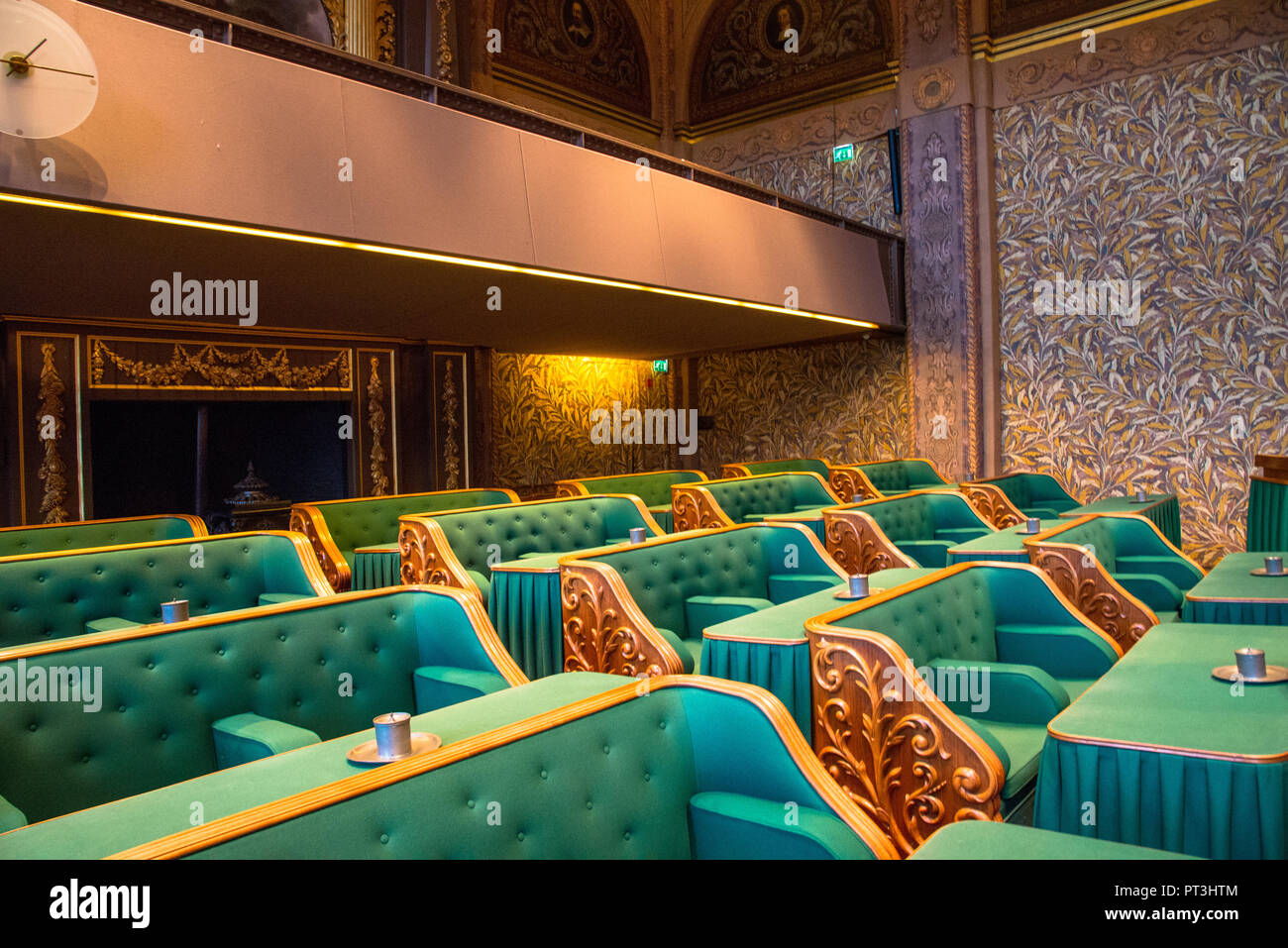 green chairs in first chamber of dutch parliament building in Den Haag