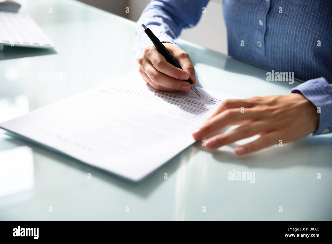 Businesswoman's Hand Signing Contract With Pen Over Desk Stock Photo ...