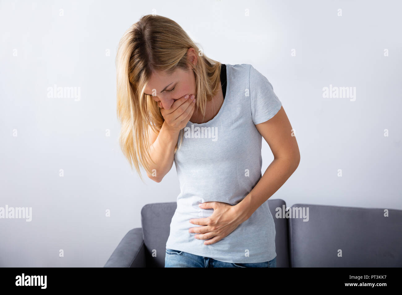 young-pregnant-woman-suffering-from-nausea-at-home-stock-photo-alamy