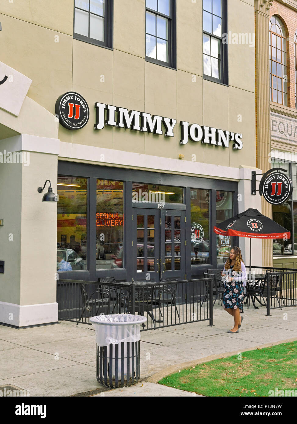 Jimmy John's fast food sandwich shop or restaurant front exterior entrance with small patio in downtown Montgomery Alabama, USA. Stock Photo