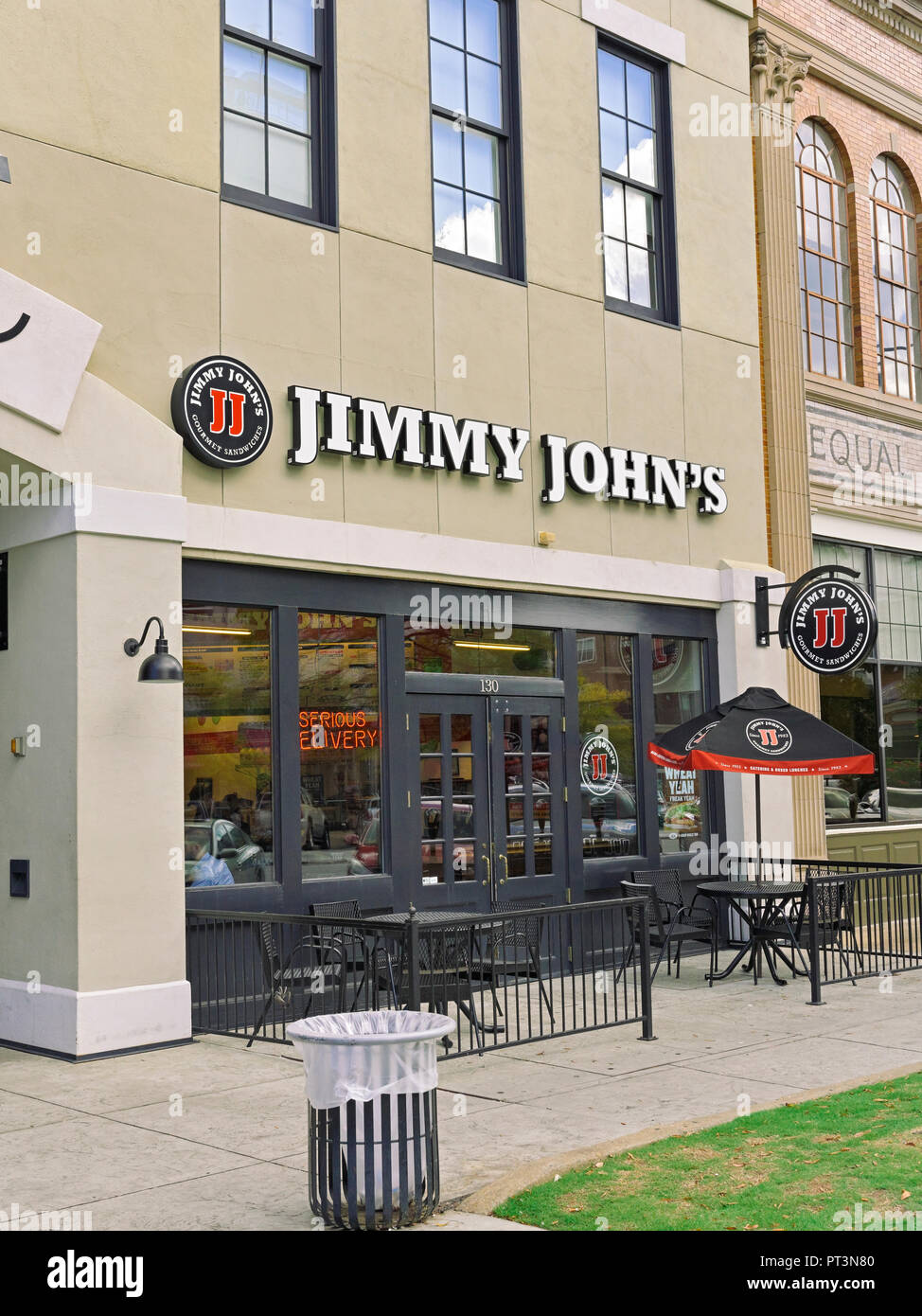 Jimmy John's fast food sandwich shop or restaurant front exterior entrance with small patio in downtown Montgomery Alabama, USA. Stock Photo