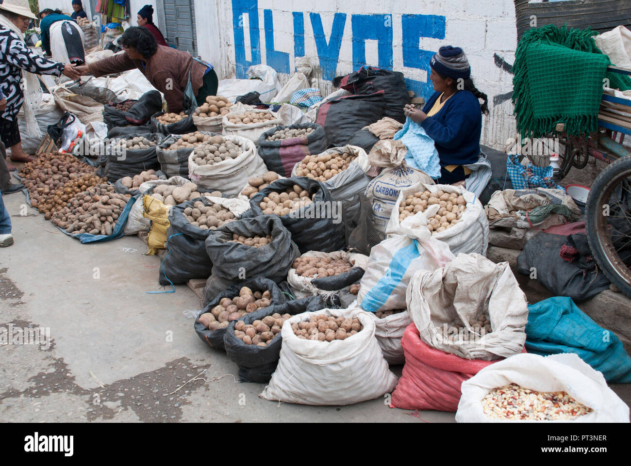 Indigenous women selling potatoes for street shopping in Huancayo. Stock Photo