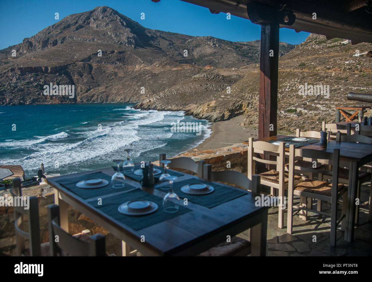 restaurant overlooking Marmari Beach in Greece Stock Photo