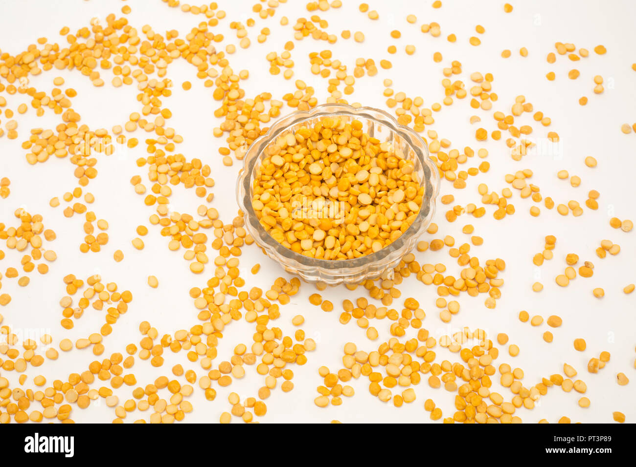 Yellow split chickpea peas boot chana dal pulse bean isolated on white