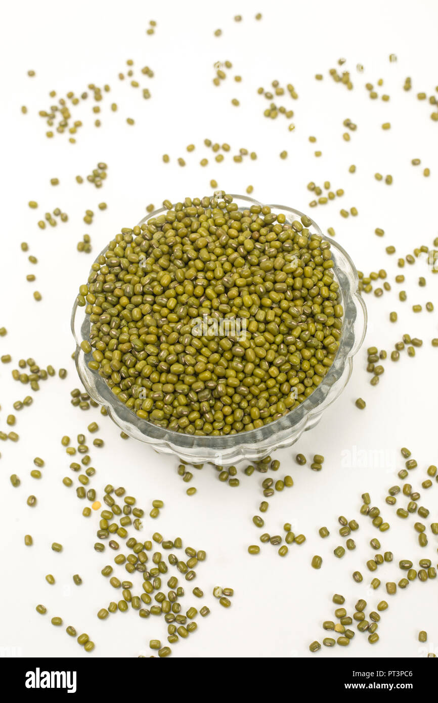 Green mung dal in glass bowl isolated on white background. Stock Photo