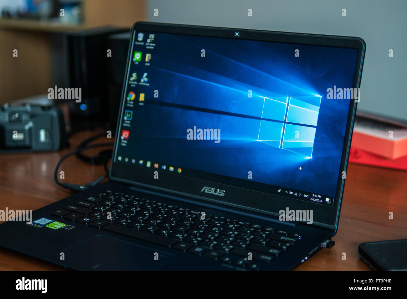 Bangkok, Thailand - August 13, 2018 : Laptop computer showing its screen with Microsoft Windows logo on desktop. Stock Photo