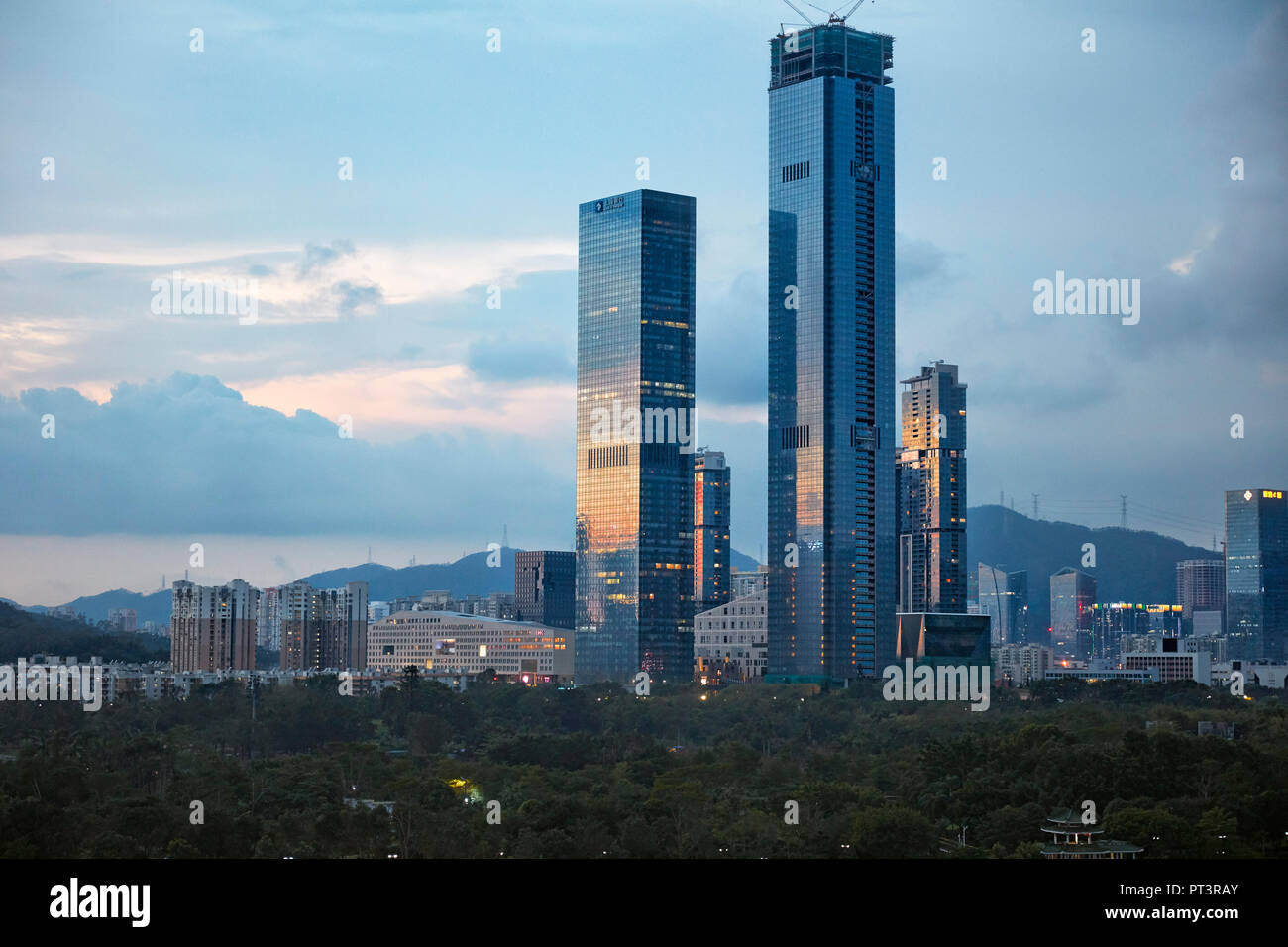 High-rise buildings in Futian District at dusk. Shenzhen, Guangdong Province, China. Stock Photo