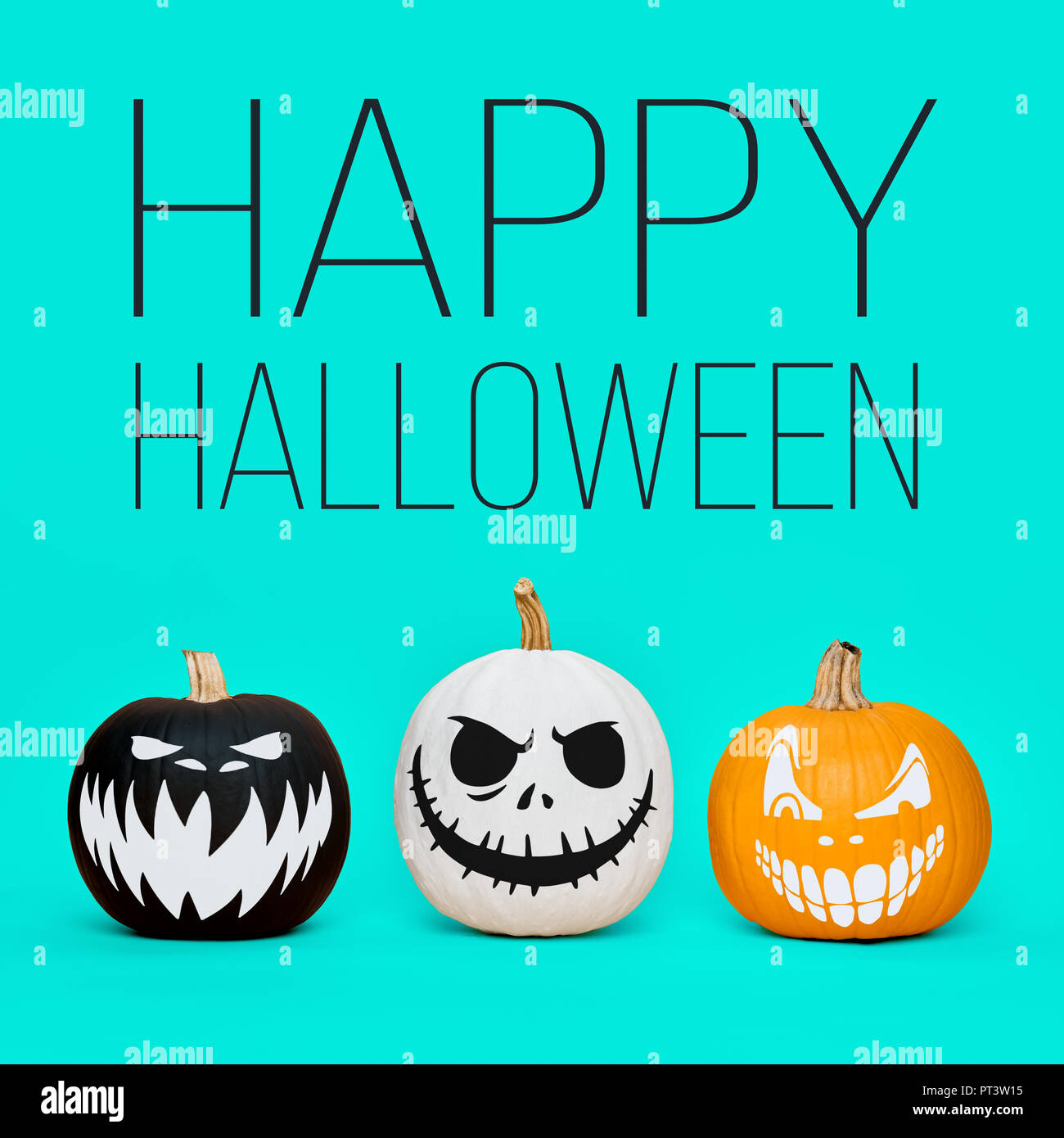 Three Spooky Halloween pumpkins with scary face expressions over pastel ...