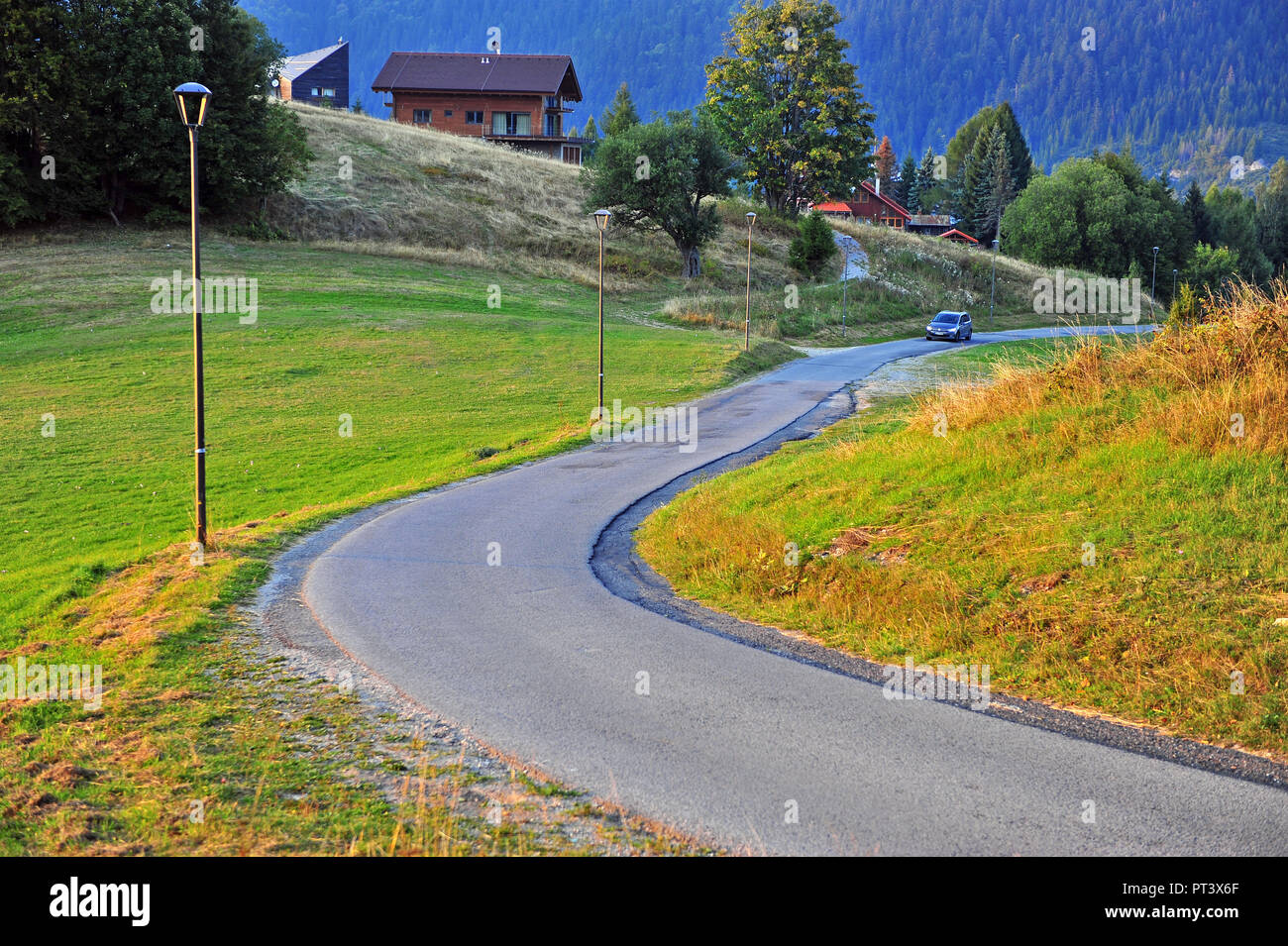 DONOVALY, SLOVAKIA - SEPTEMBER 20: Car moving by the rural road in Donovaly village, Slovakia on September 20, 2018. Stock Photo