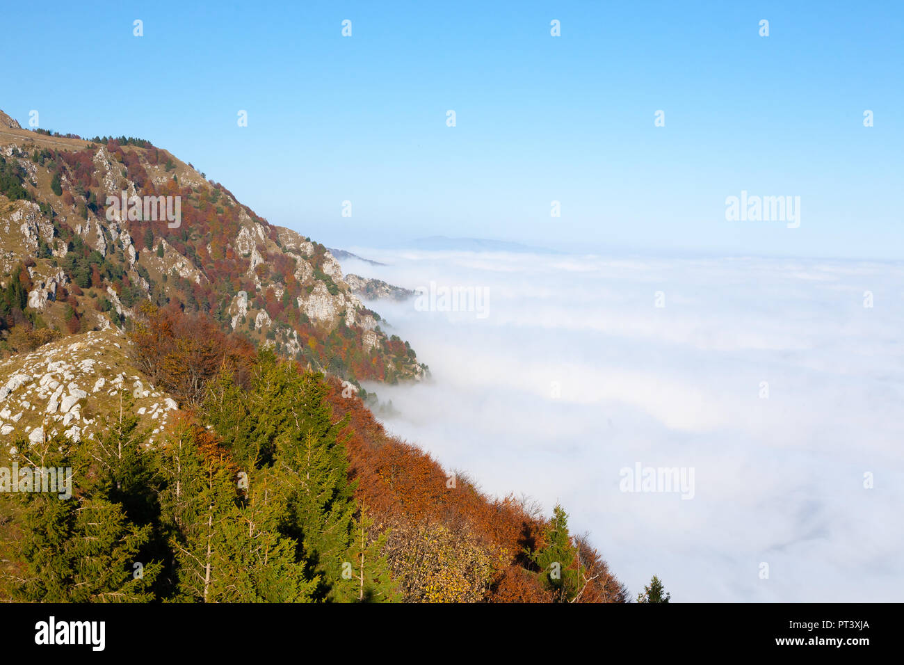 Panorama from Italian alps, carpet of clouds and peaks. Top mountain landscape Stock Photo