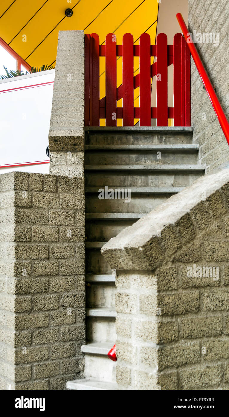 Entrance to the Cube house with stairs and small red gate. It is a set of innovative houses in Rotterdam, Netherlands Stock Photo