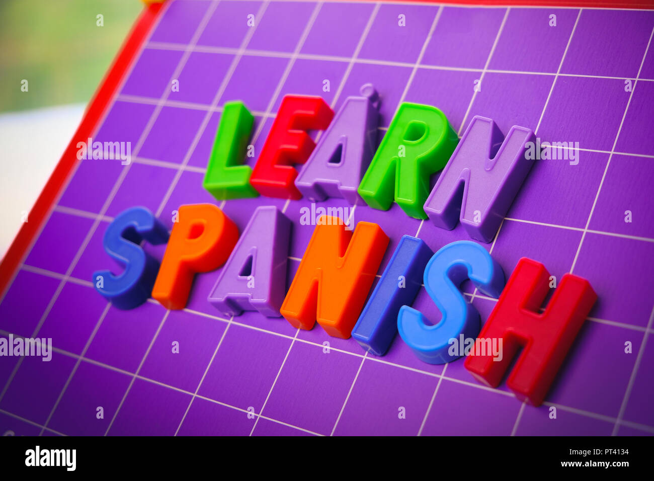 learn spanish language alphabet on magnets letters  Stock Photo