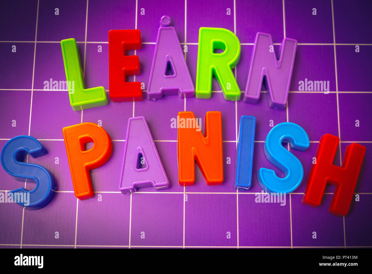 learn spanish language alphabet on magnets letters  Stock Photo