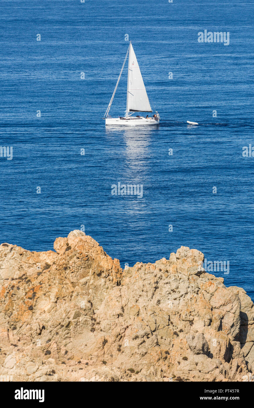 Sailboat in the surroundings of Tower of Omigna (Tour d'Omigna), Cargese, Corsica, France Stock Photo