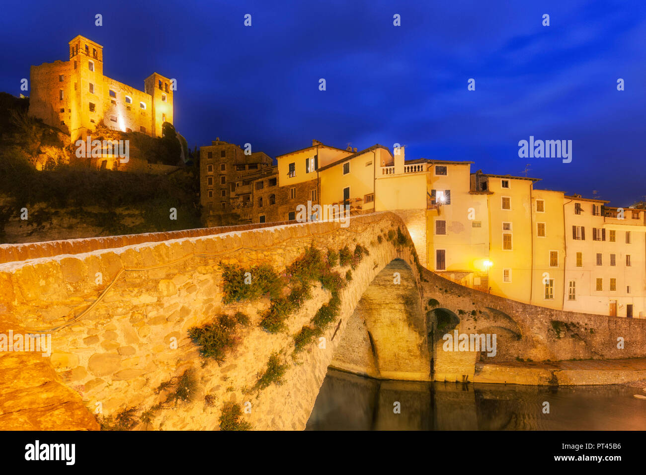 Old bridge and the village of Dolceacqua during twilight, Dolceacqua, Province of Imperia, Liguria, Italy, Europe, Stock Photo