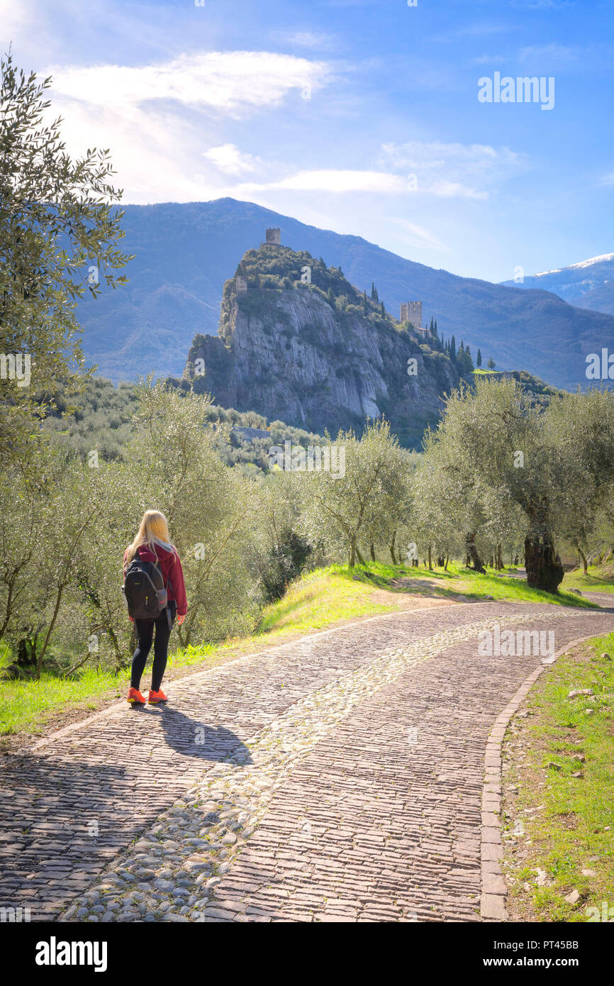 A young tourist walks on the Via Crucis, Arco di Trento, Trento province, Trentino Alto Adige, Italy, Europe, Stock Photo