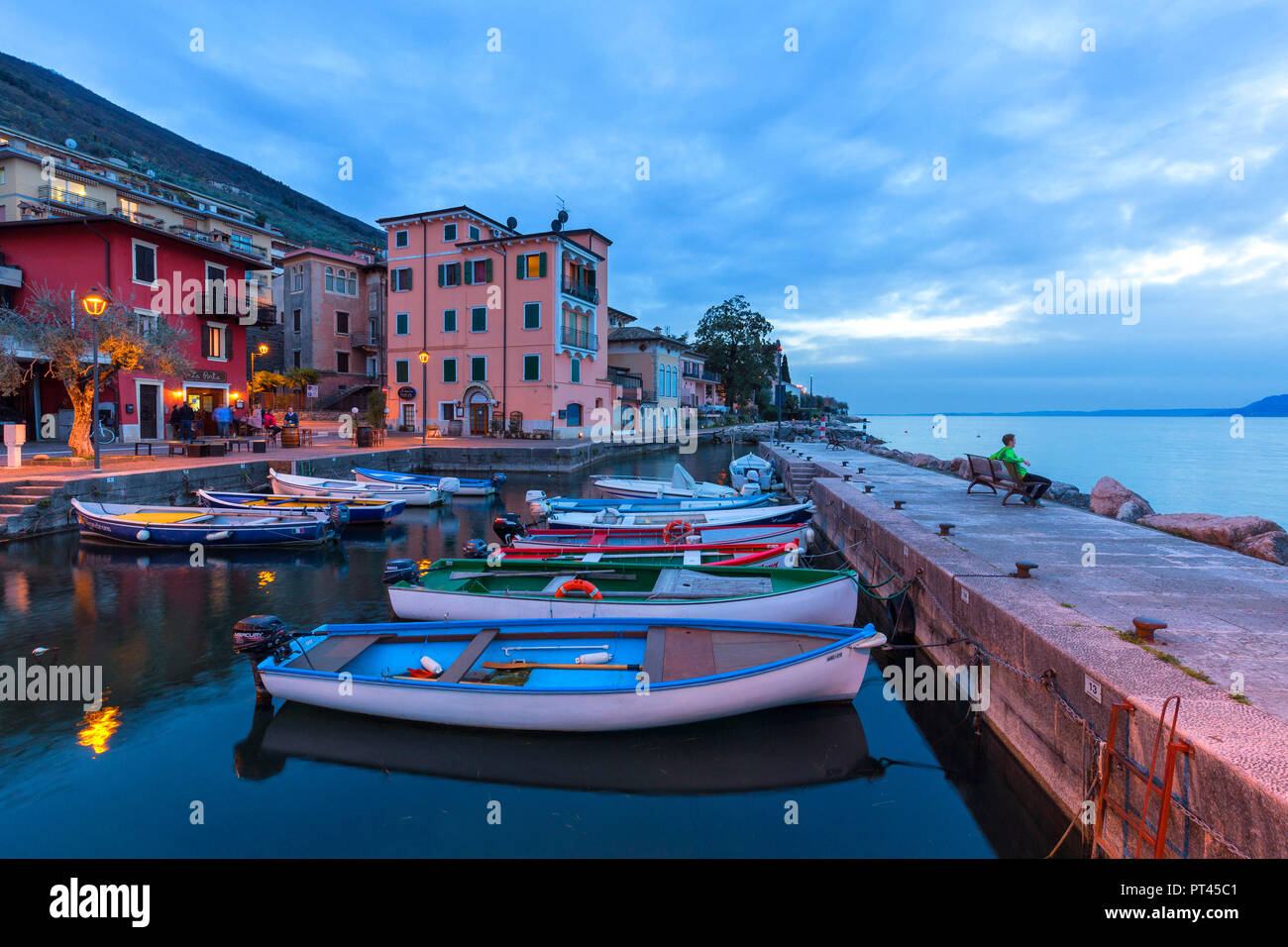 Twilight at the little harbour of Macugnano, Brenzone sul Garda, Garda Lake, Verona province, Veneto, Italy, Europe, Stock Photo