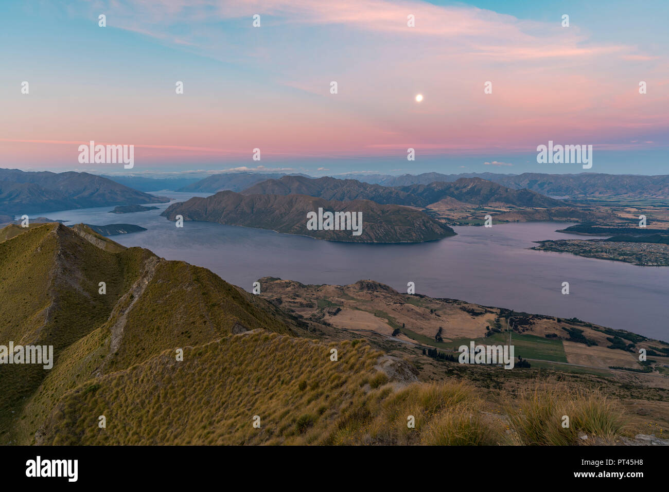 Moonlight over Lake Wanaka at sunset, Wanaka, Queenstown Lakes district, Otago region, South Island, New Zealand, Stock Photo