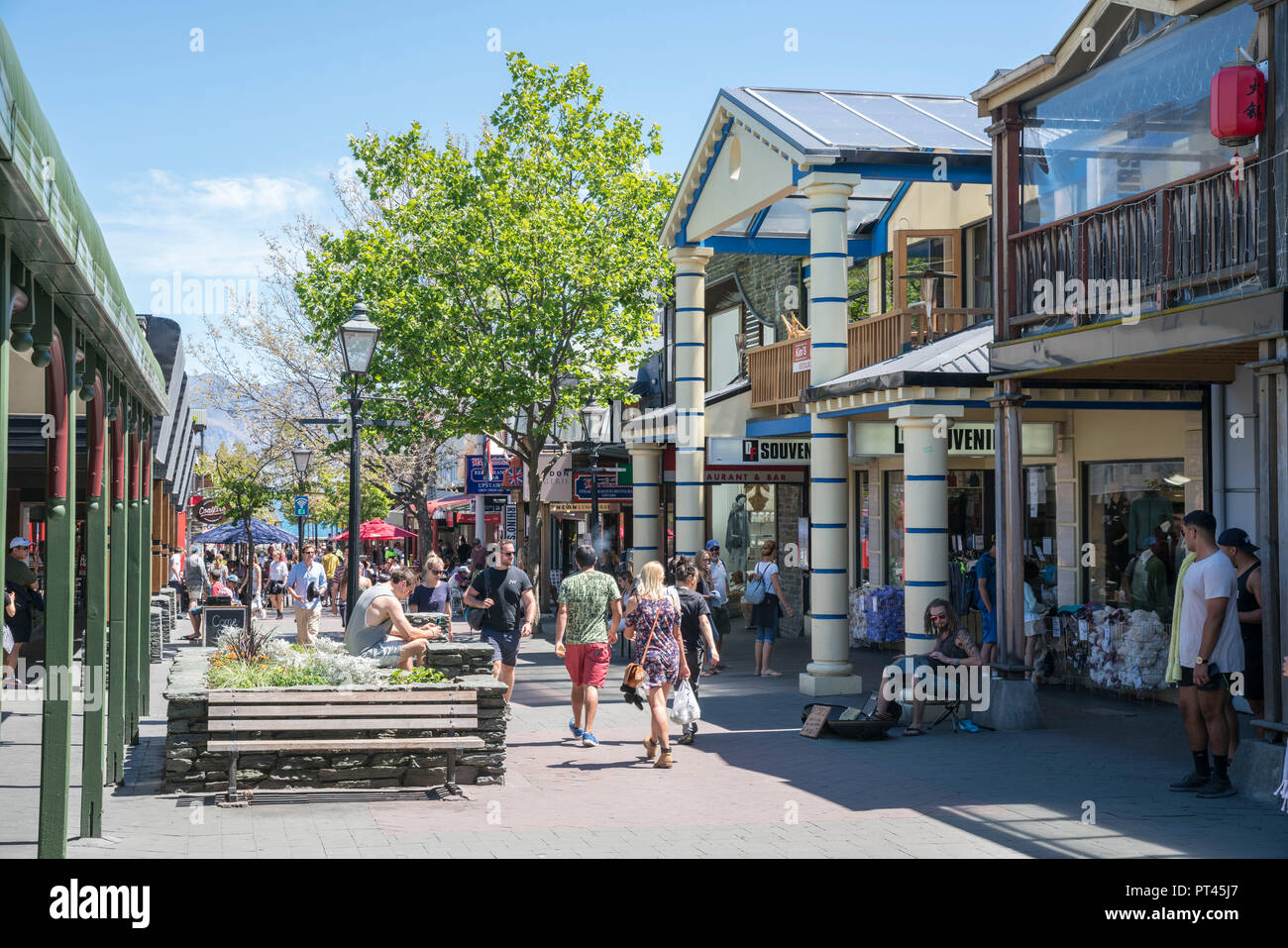 People in Mall Street in Queenstown in summer, Queenstown Lake district, Otago region, South Island, New Zealand, Stock Photo