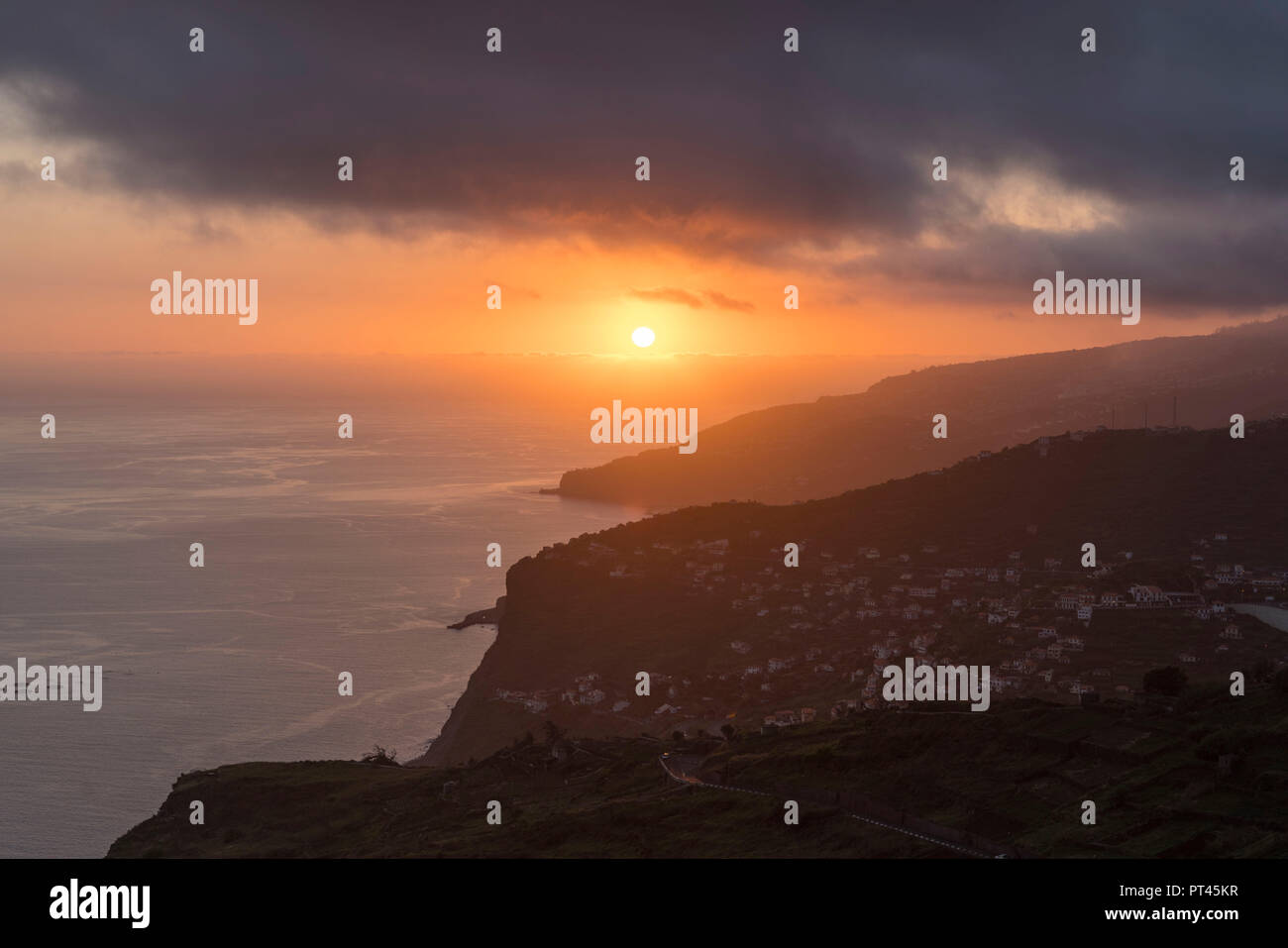The village of Campanario and, in the background, Ribeira Brava at sunset, Madeira region, Portugal, Stock Photo