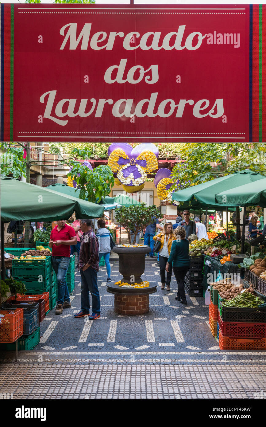 Customers under the sign at the entrance of Mercado dos Lavradores - Farmers' Market, Funchal, Madeira region, Portugal, Stock Photo