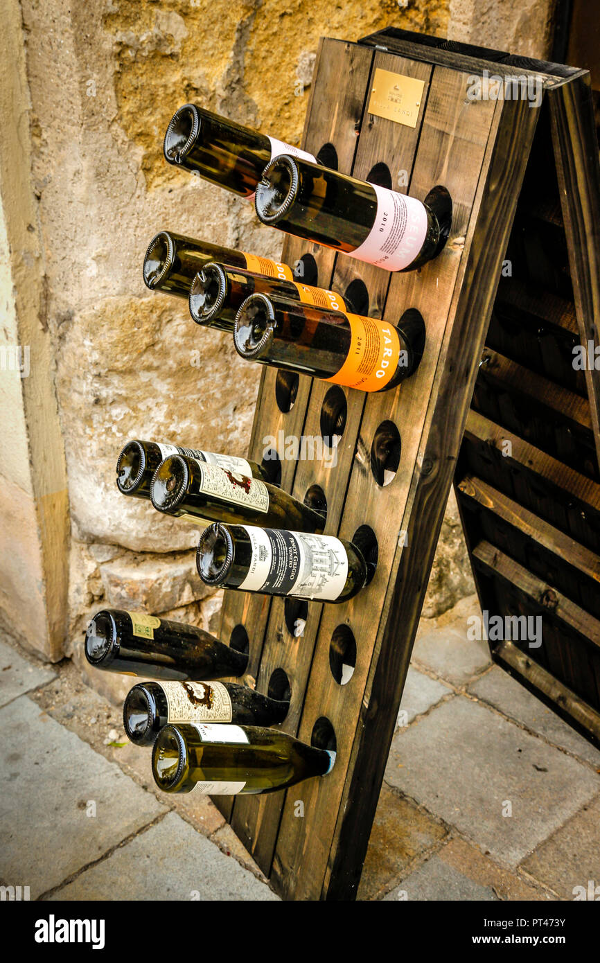 Restaurants wine selection displayed in front of entrance in historic old building in  Eastern European city of Bratislava, Slovakia Stock Photo