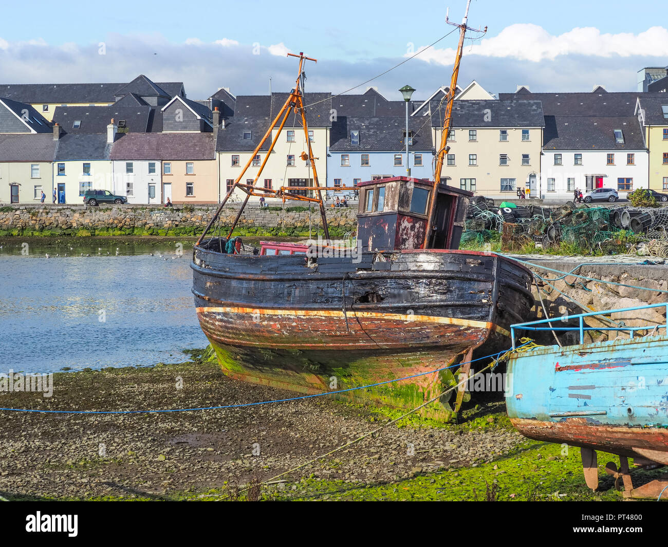 GALWAY, IRELAND AUGUST 3, 2018 An old fishing boat next to the River